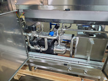 Load image into Gallery viewer, picture shows open service bay doors showing the SS pumps and the sanitizing rinse tank on the  300 bottle per hour 18.9 liter wash, fill, cap system. 304SS construction, CSA Certified