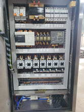 Load image into Gallery viewer, Inside the control panel showing contactors, breakers, transformers, PLC control system and more on the WFC bottling systems. Every unit is CSA approved. 