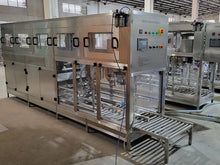 Load image into Gallery viewer, Factory view with multiple WFC300 18.9 liter bottling machines. 