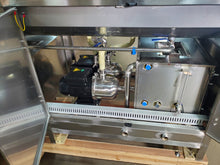 Load image into Gallery viewer, picture shows open service bay doors showing the SS pumps and the  insulated hot water wash tank on the  300 bottle per hour 18.9 liter wash, fill, cap system. 304SS construction, CSA Certified